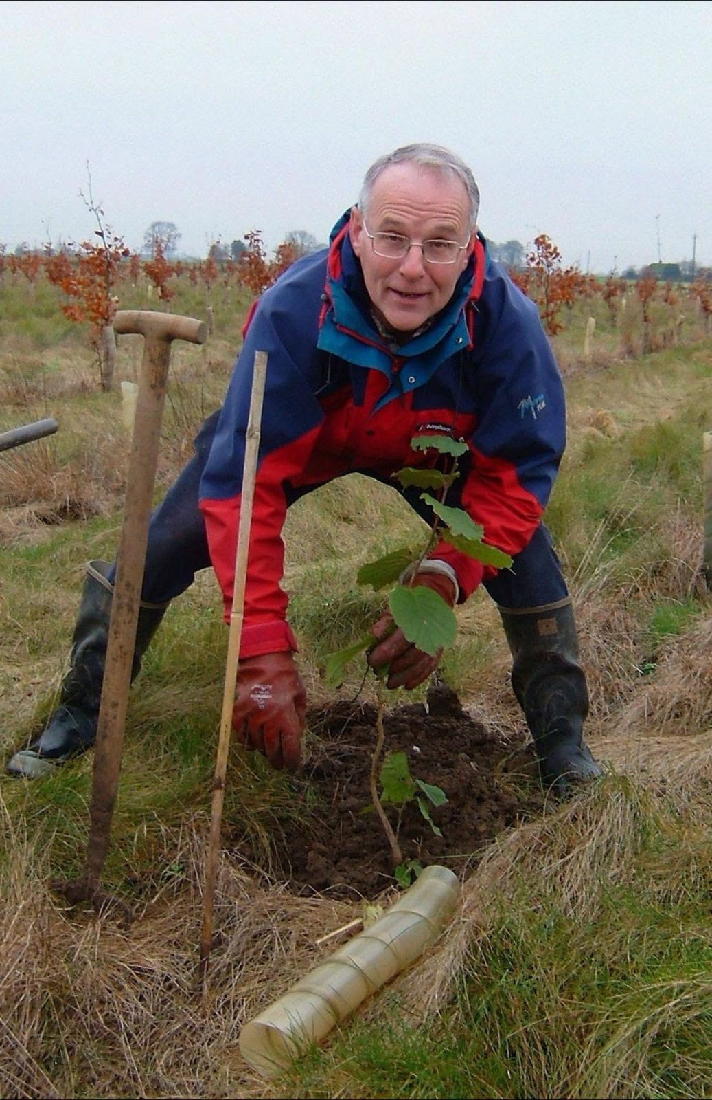 Adrian Isaac, founder of the Trust, planting a tree